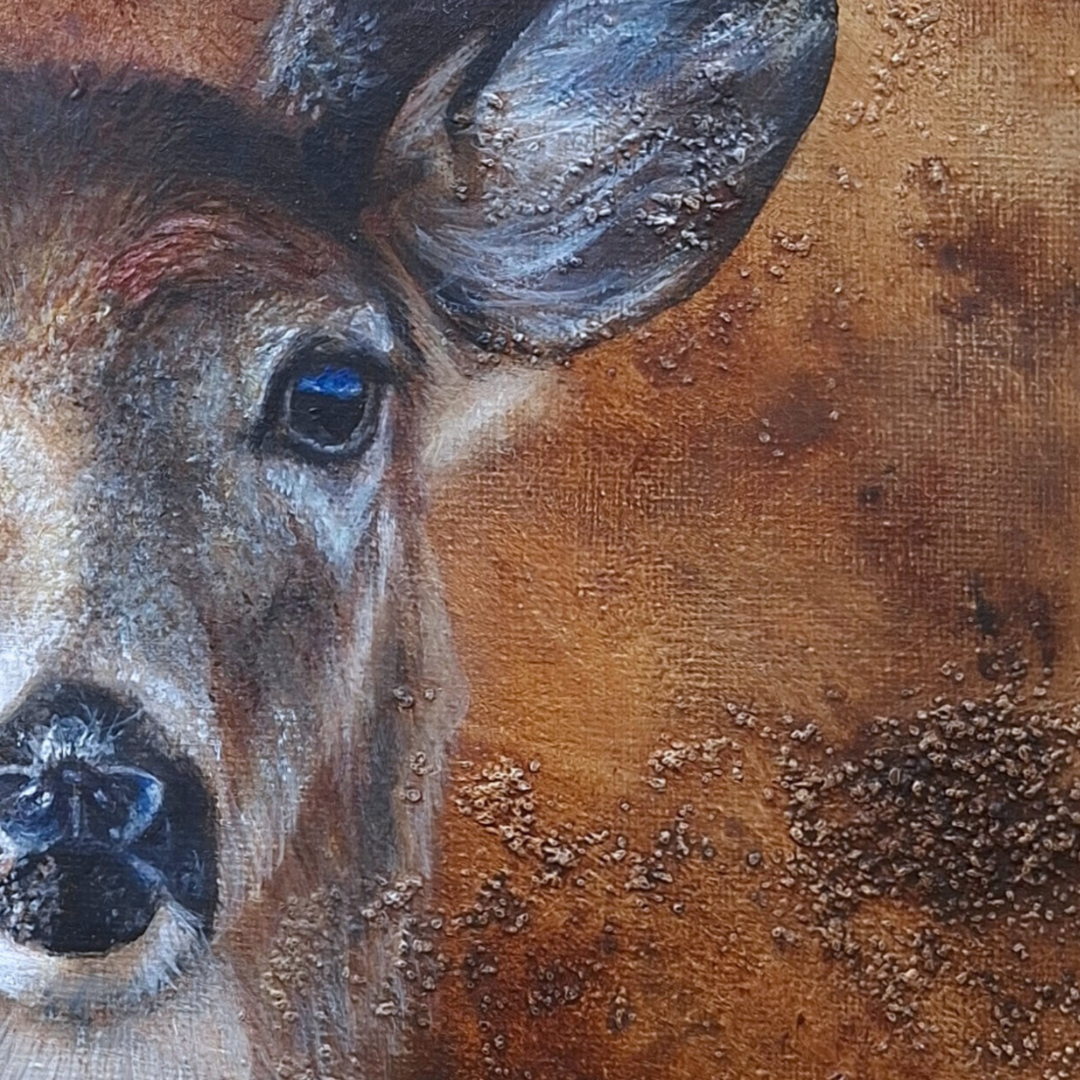 Close-up of a textured painting of a deer face, showing the ear, eye with a blue reflection, nose, and warm brown background.
